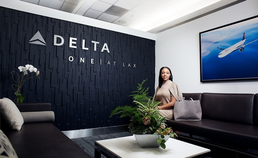 A person sitting in the Delta One waiting area.