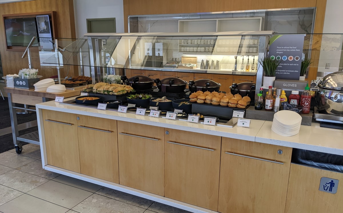 full buffet with sandwiches, salad, and other snacks.