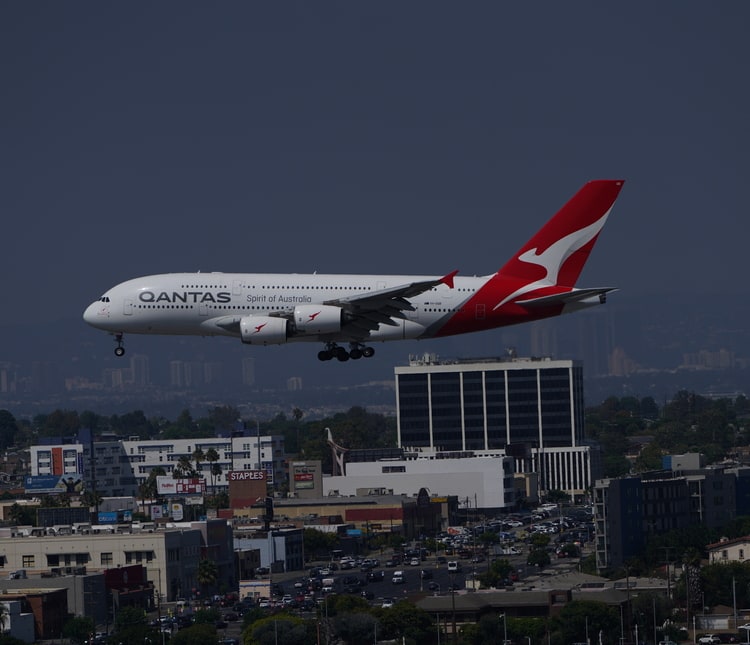 view from the roof of the H Hotel of an Airbus A380 landing.