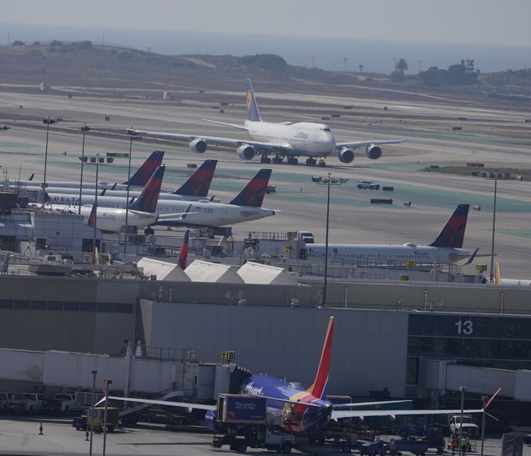 view from the roof of the H Hotel of LAX airport with planes.