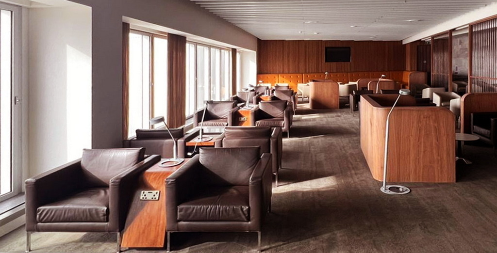 Chairs and tables at London LHR Blush Lounge.