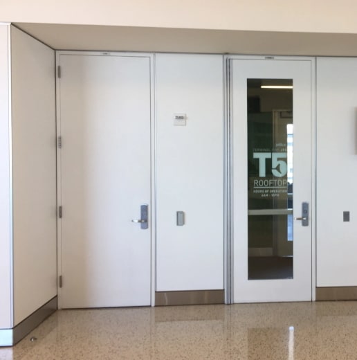 Patio door going from terminal T5 to the deck.