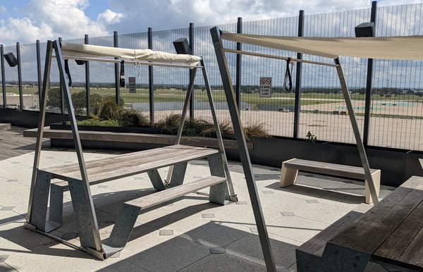 covered picnic bench on patio.