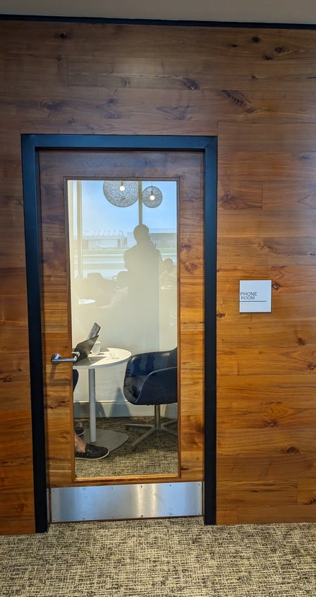 phone room, with closed door and area for meetings.