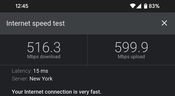 Wi-Fi speed test results, showing 516 down and 599 up.