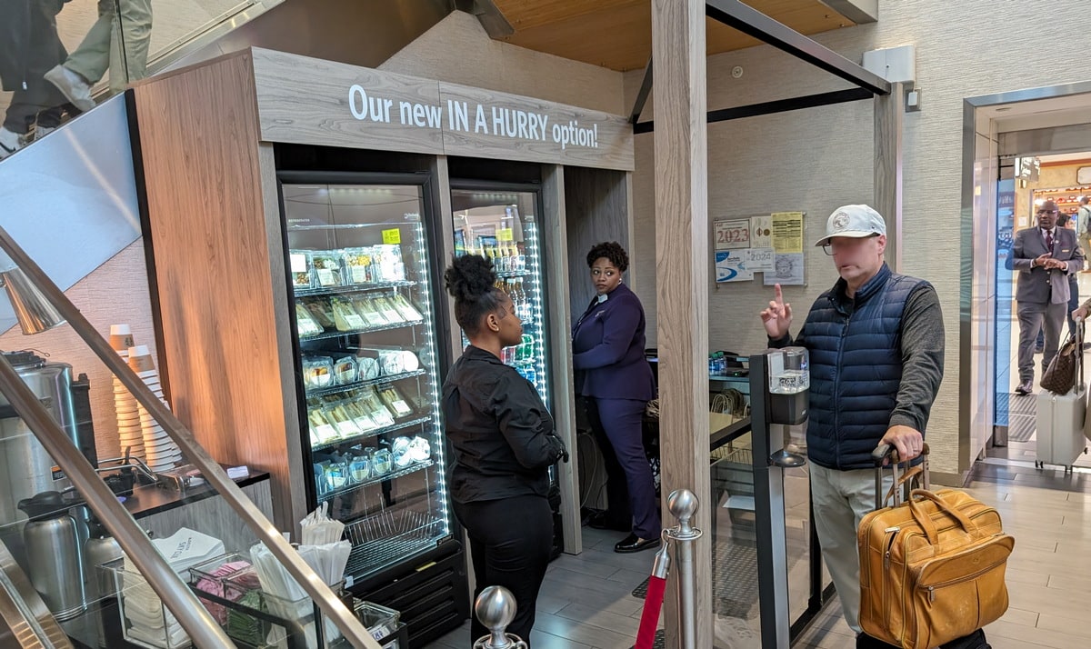 person standing at the Grab and Go area at Delta Sky Club in Atlanta.