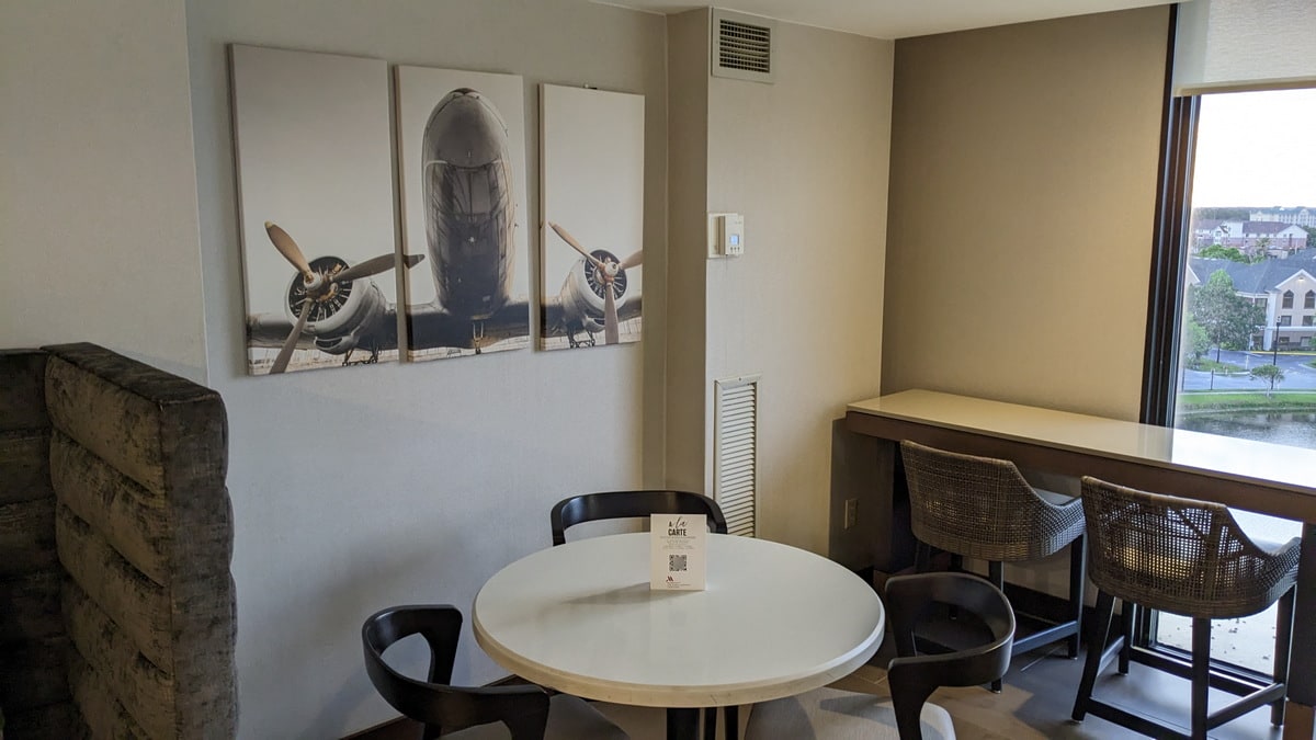 seating with window view of the lake and art on the walls.