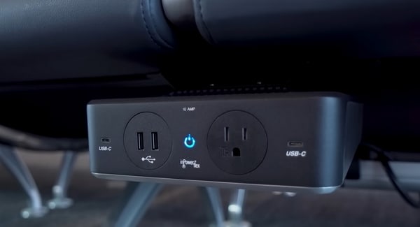 charging power plugs under seating in gate area.