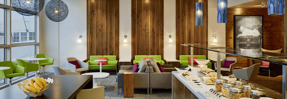 Inside the Centurion Lounge with buffet and windows.