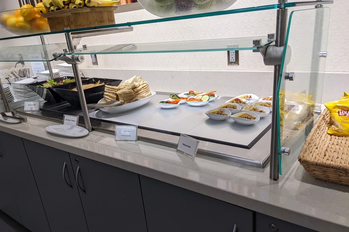 self-serve food buffet with plated items.