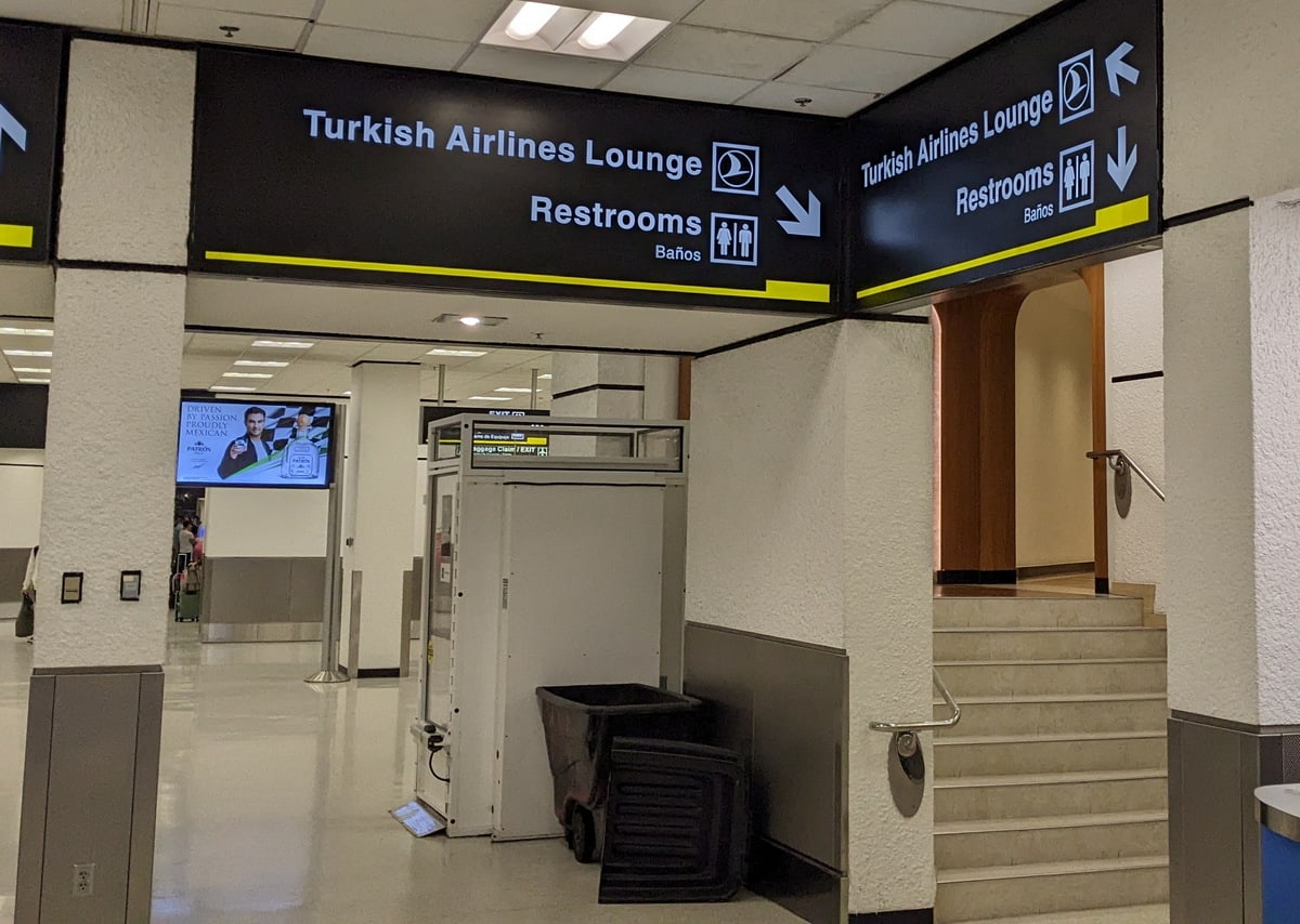 Steps and chairlift in the terminal area showing the access hallway to the Turkish Airlines lounge.