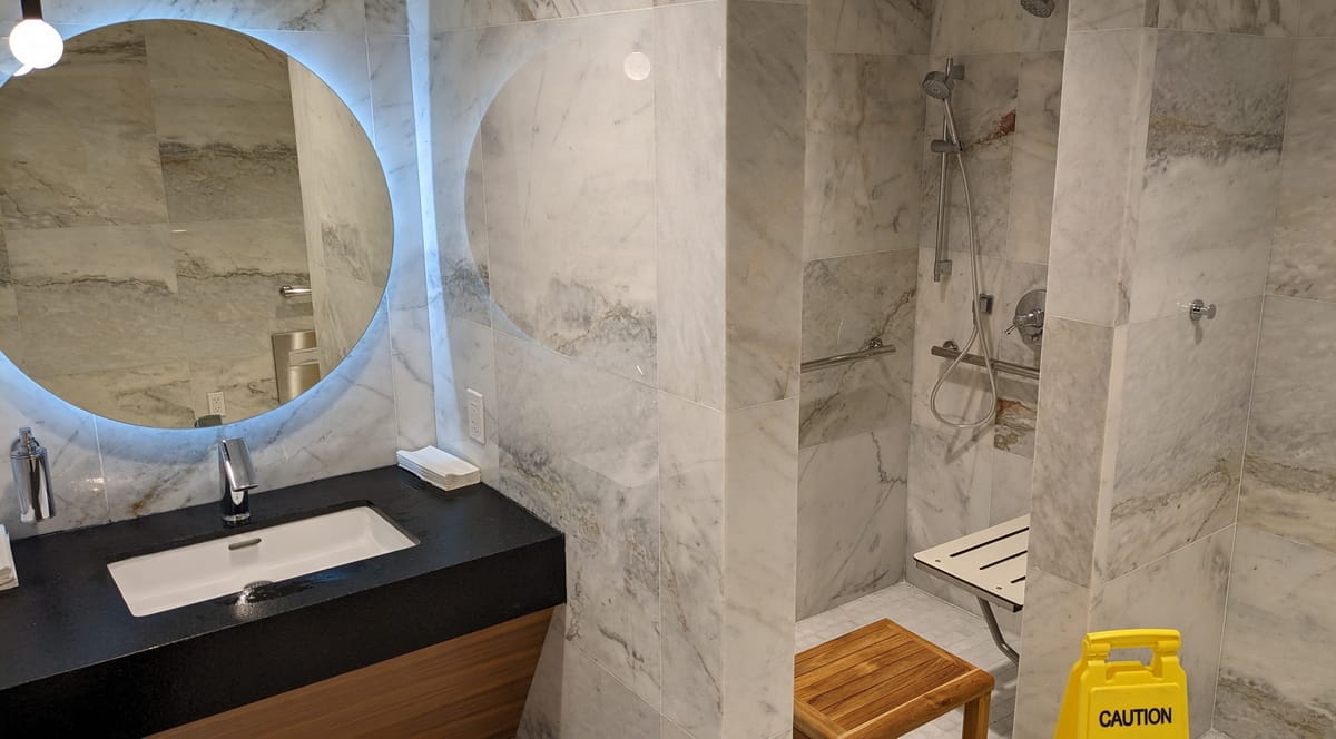 Restroom inside the Turkish Airlines lounge in H concourse, showing the shower and the sink area.