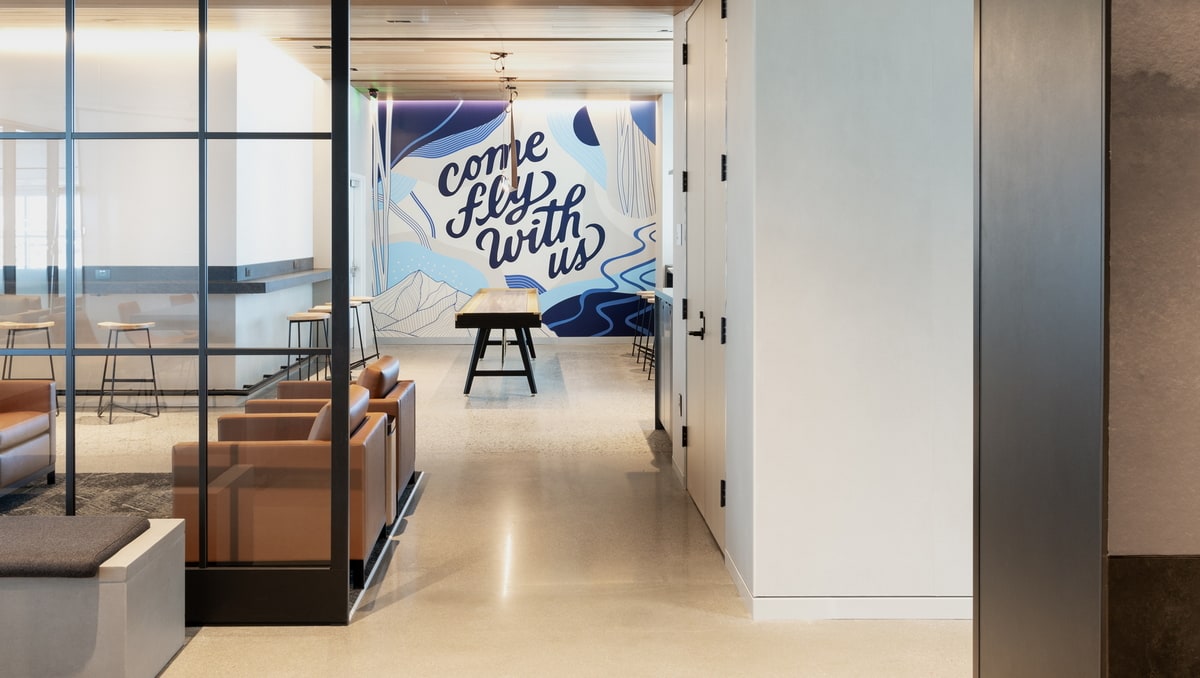 United Club in Denver seating and game room in the background.