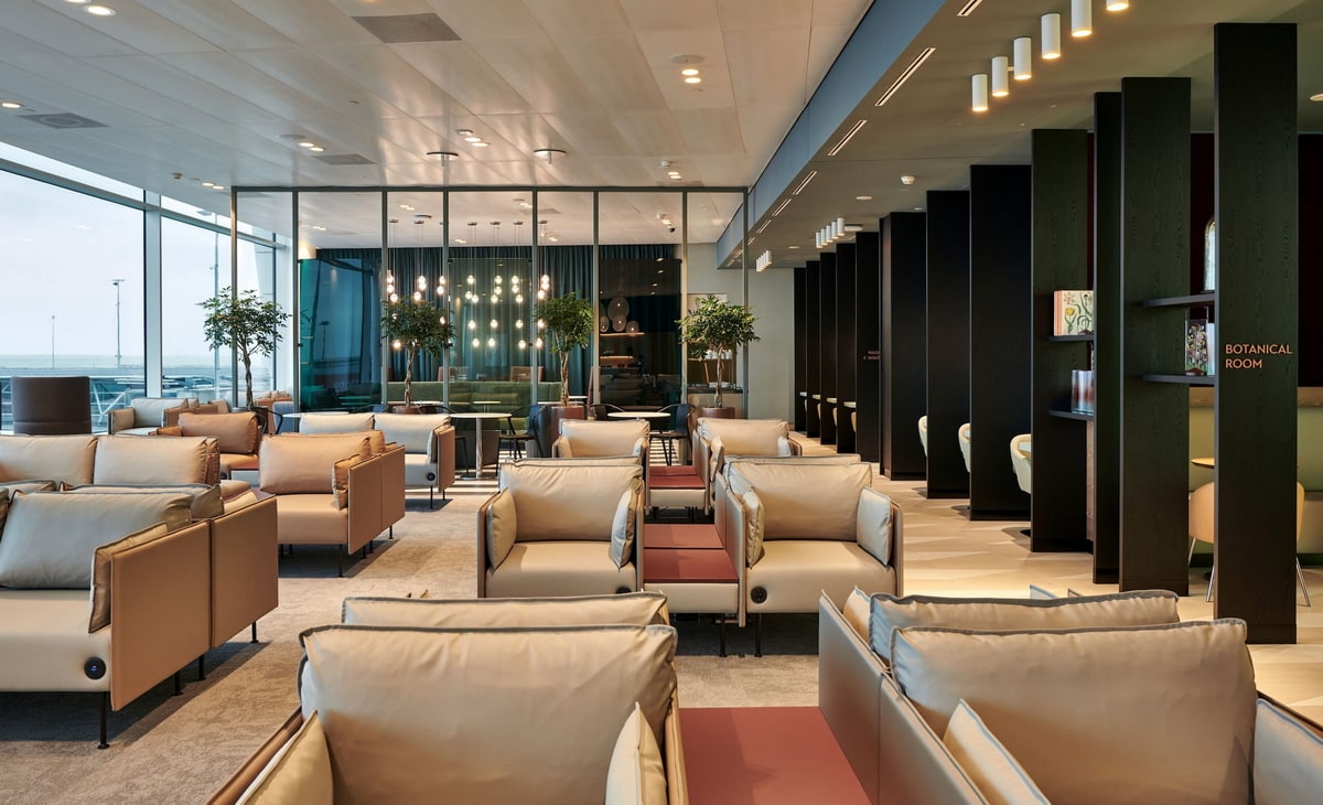 seating and tables, with large windows in the background.