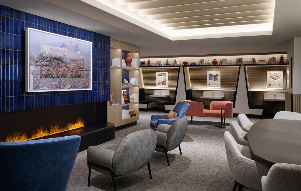 relaxation room, with conference table, booths, and fireplace.