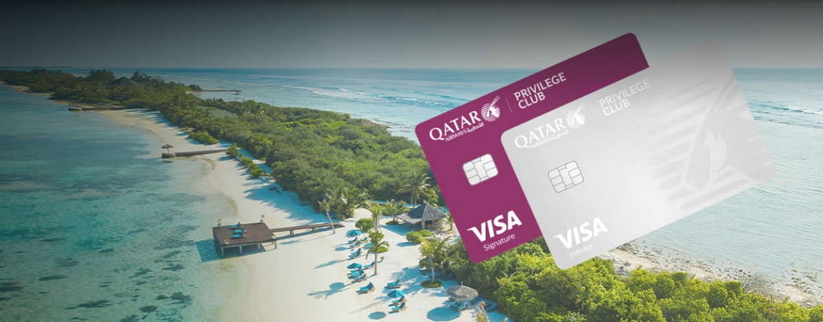 Qatar Airways credit cards showing with picture of a beach in background.