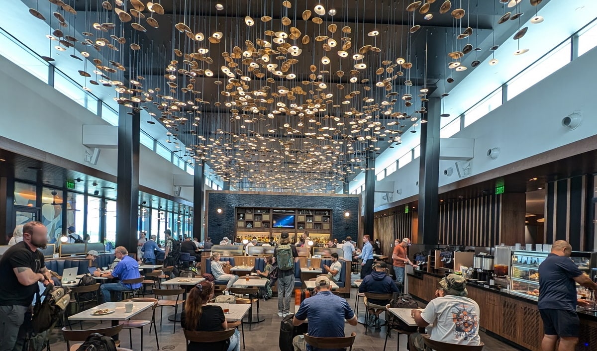 tables in the main dining area, with bar and food in the background.