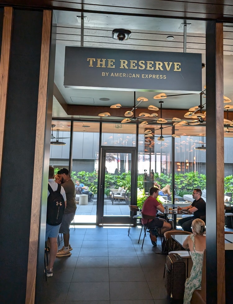 The Reserve Whiskey Bar entrance with people sitting inside.