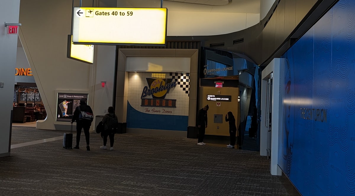the entrance of the lounge with two people standing out front
