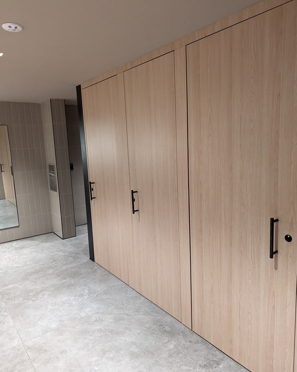 Private toilet area with floor-to-ceiling stalls.