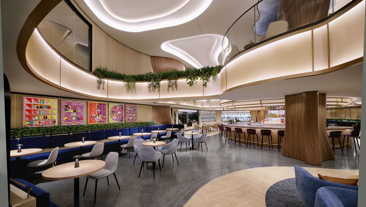 main seating area with tables and chairs, and a bar in the center.