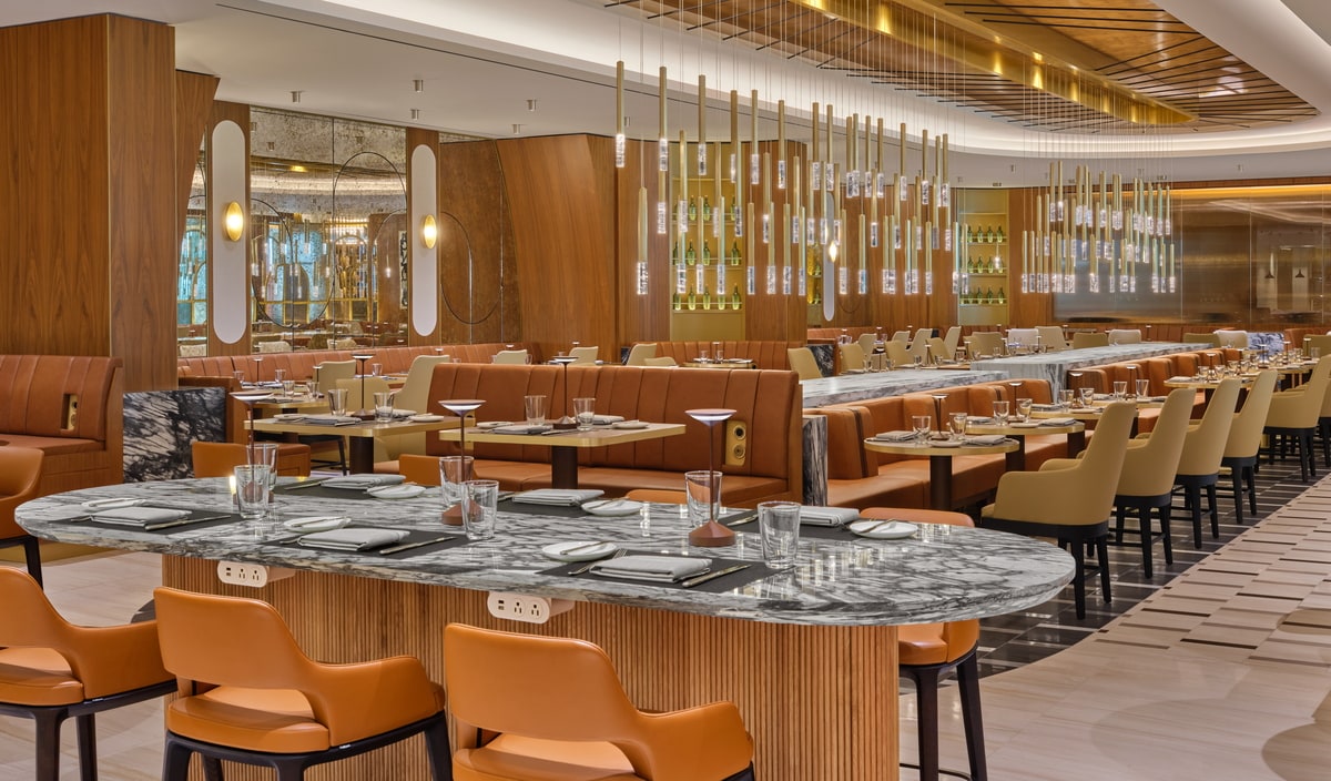dining area with plated dining on marble tables.