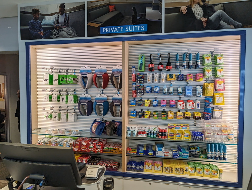 wall with food, snacks, medicine and travel supplies.