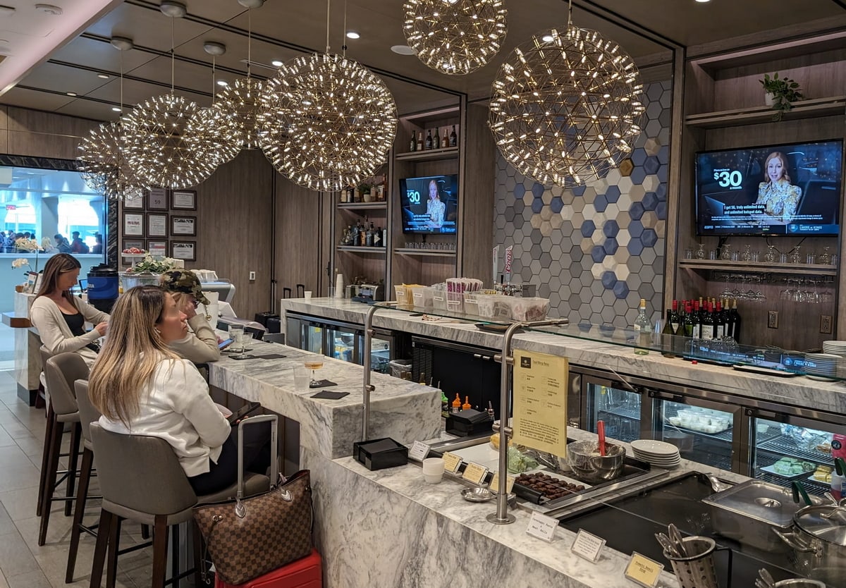 bar area with bar seating and TVs.