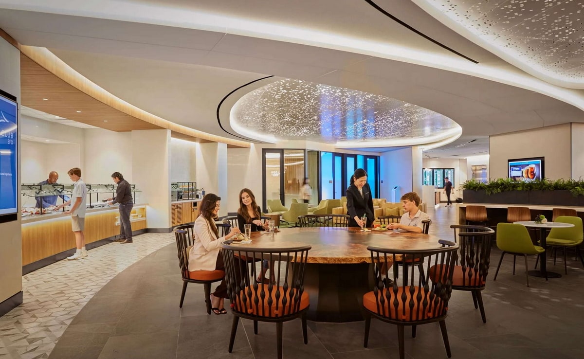 dining area with food buffet and seating.