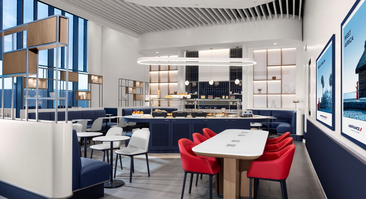 food area with dining tables and self-serve food options.