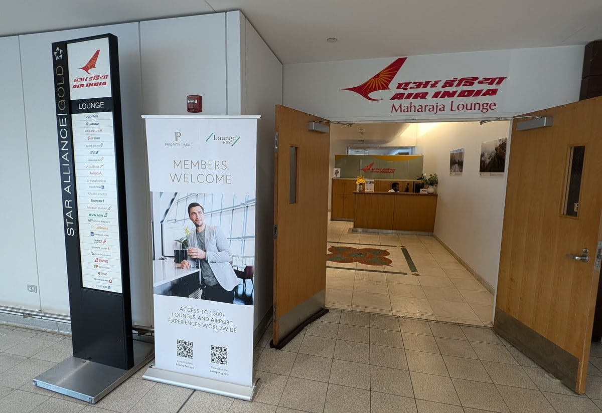 Entrance to the Air India lounge, showing door and signs.