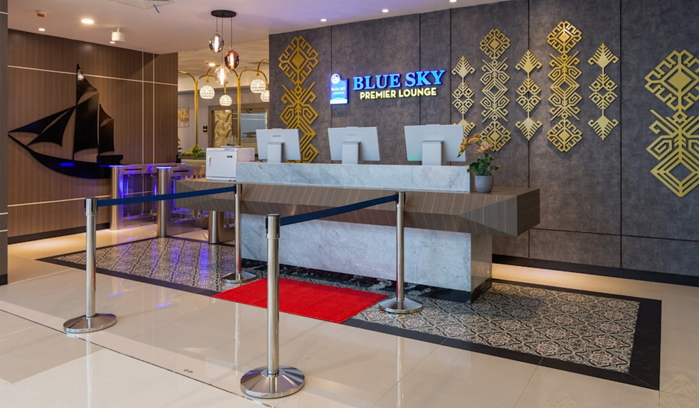 Entrance area with reception desk at the new Airport Dimensions lounge in Makassar.