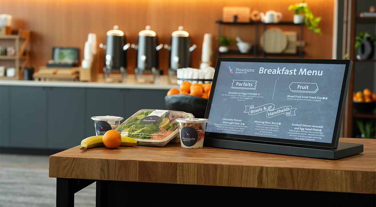 breakfast items in to-go containers, such as salmon, yogurt, and fruit.