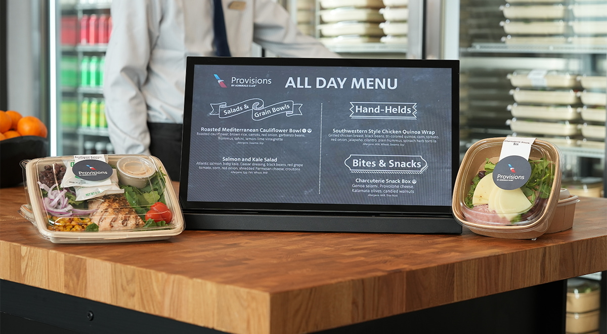 lunch items in to-go containers, such as snack box and salmon salad.