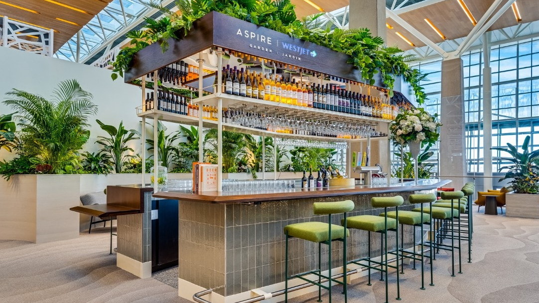 Bar area and seating with bottles above the bar.