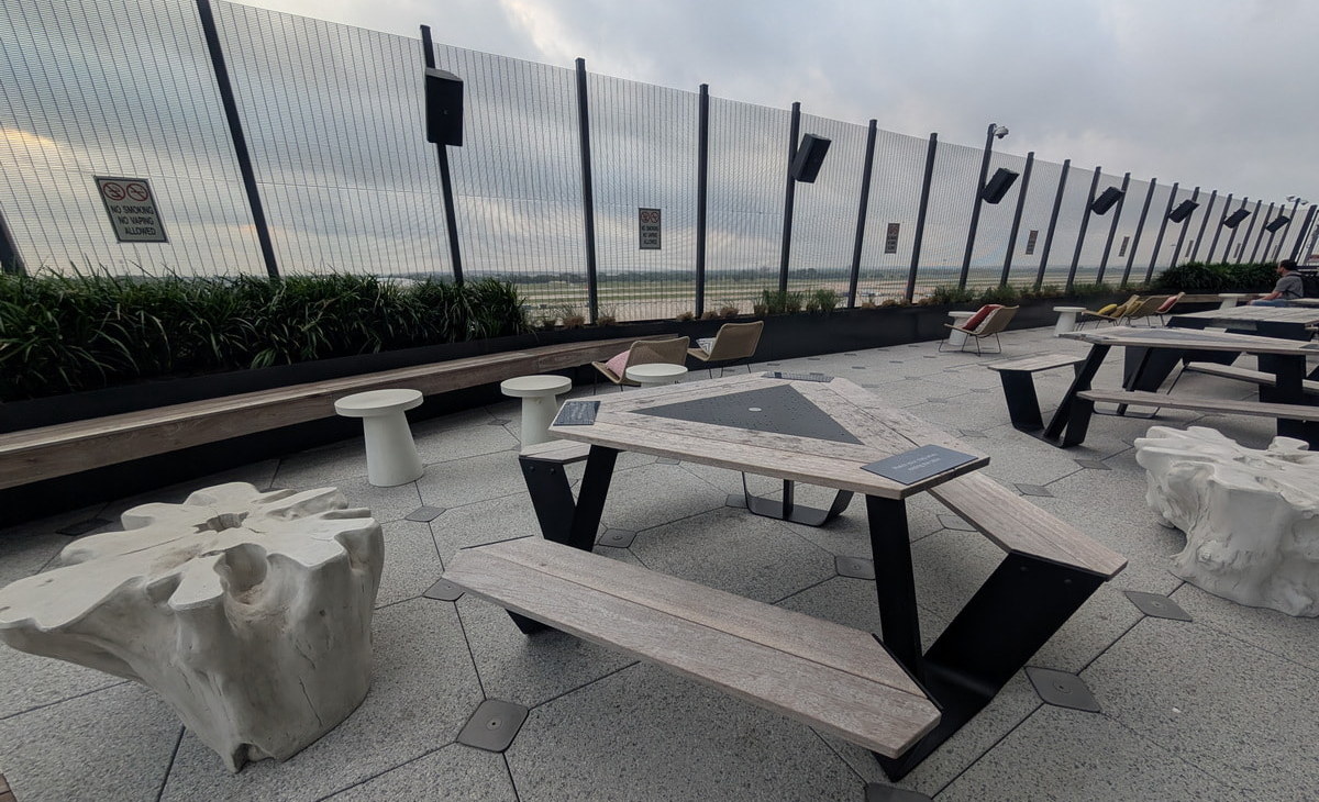 Seating and tables at Austin Airport outside terrace.