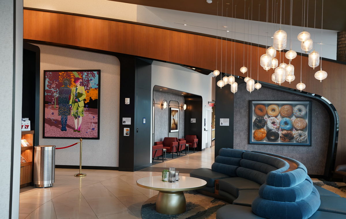 Entrance area of lounge, with art and sofas.