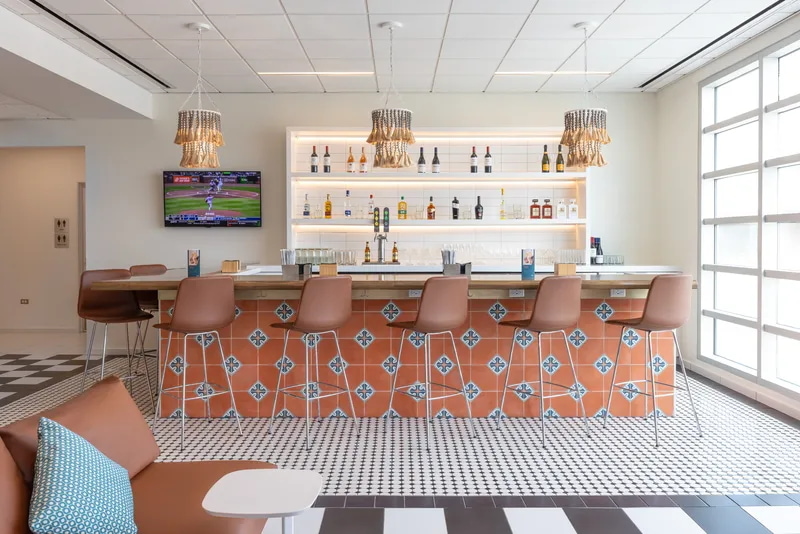 Bar area with bar seating and TV.