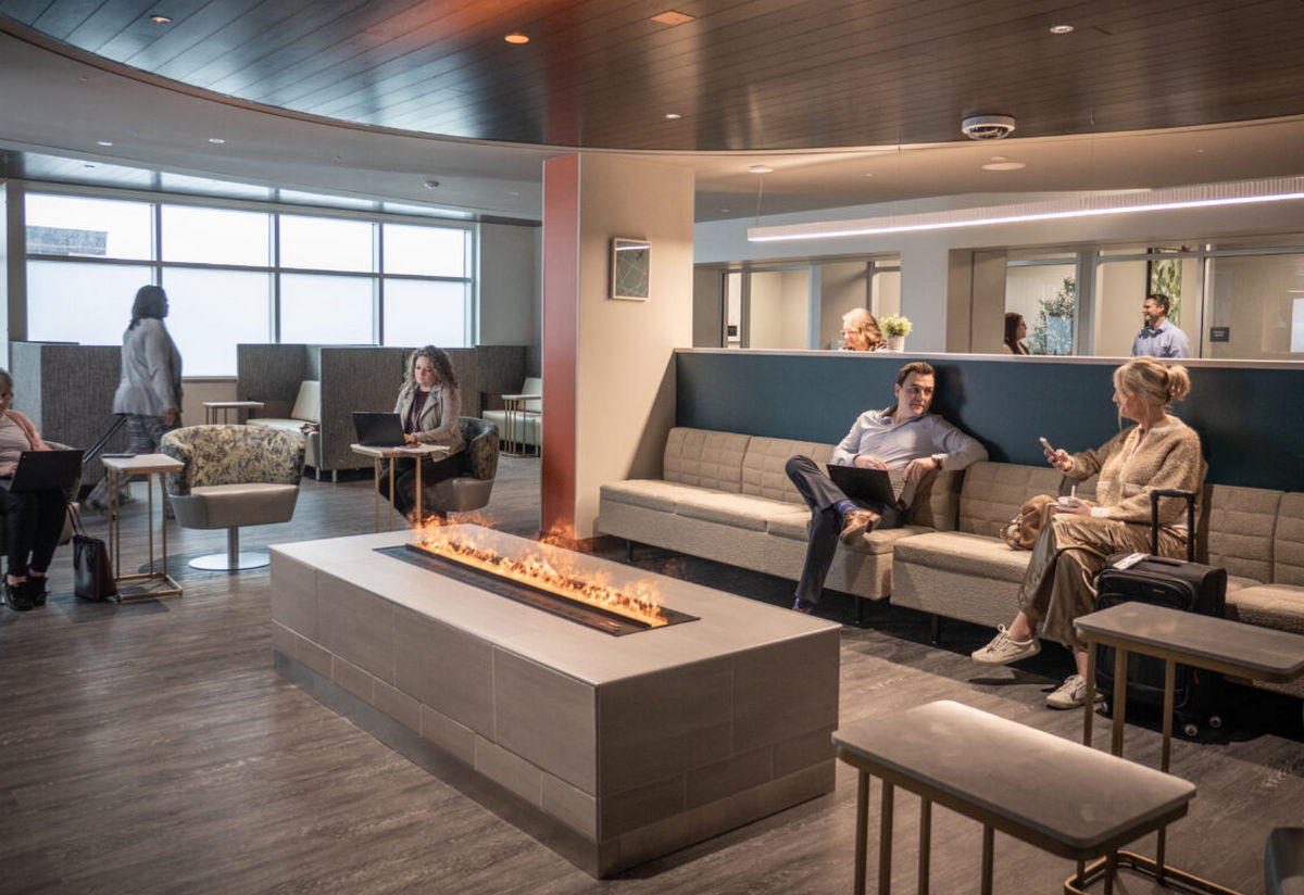 Lounge area showing seating, tables, and people relaxing.