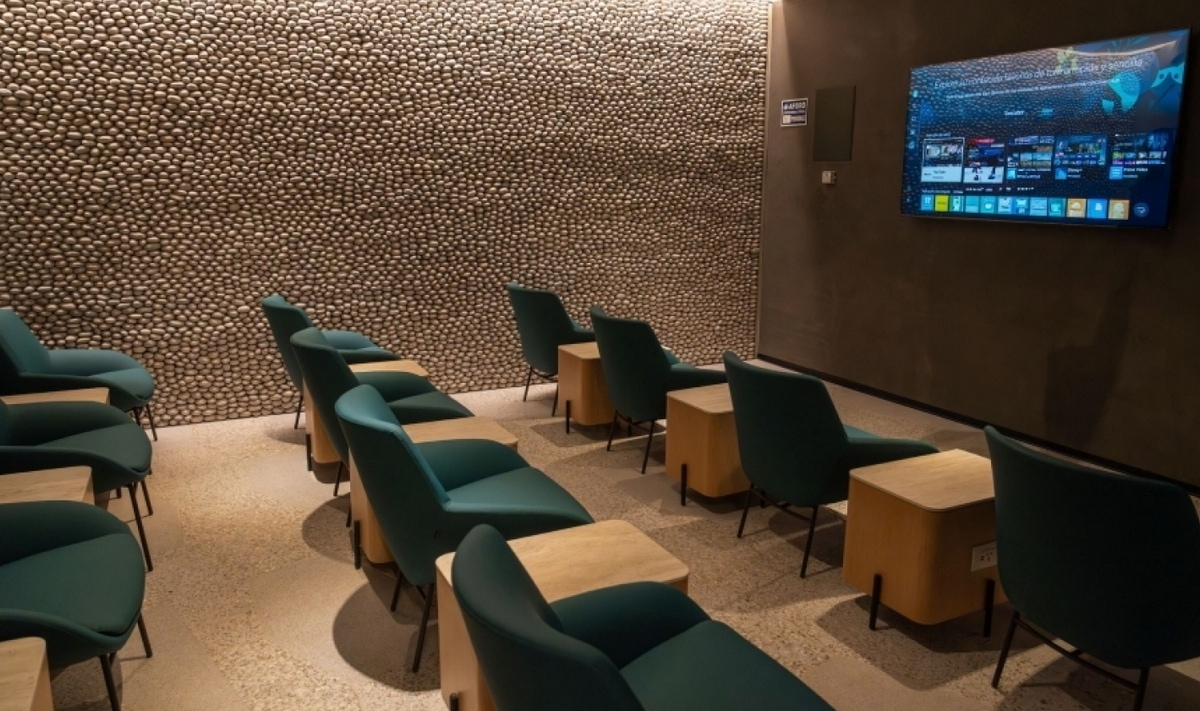 TV room with seating and chairs.