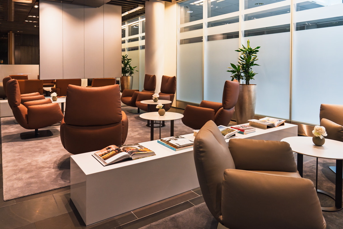 seating area with tables and leather chairs.
