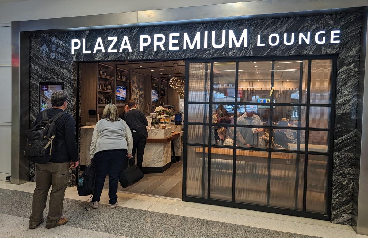 People waiting in line to enter the Plaza Premium Lounge (Terminal E) in Dallas.
