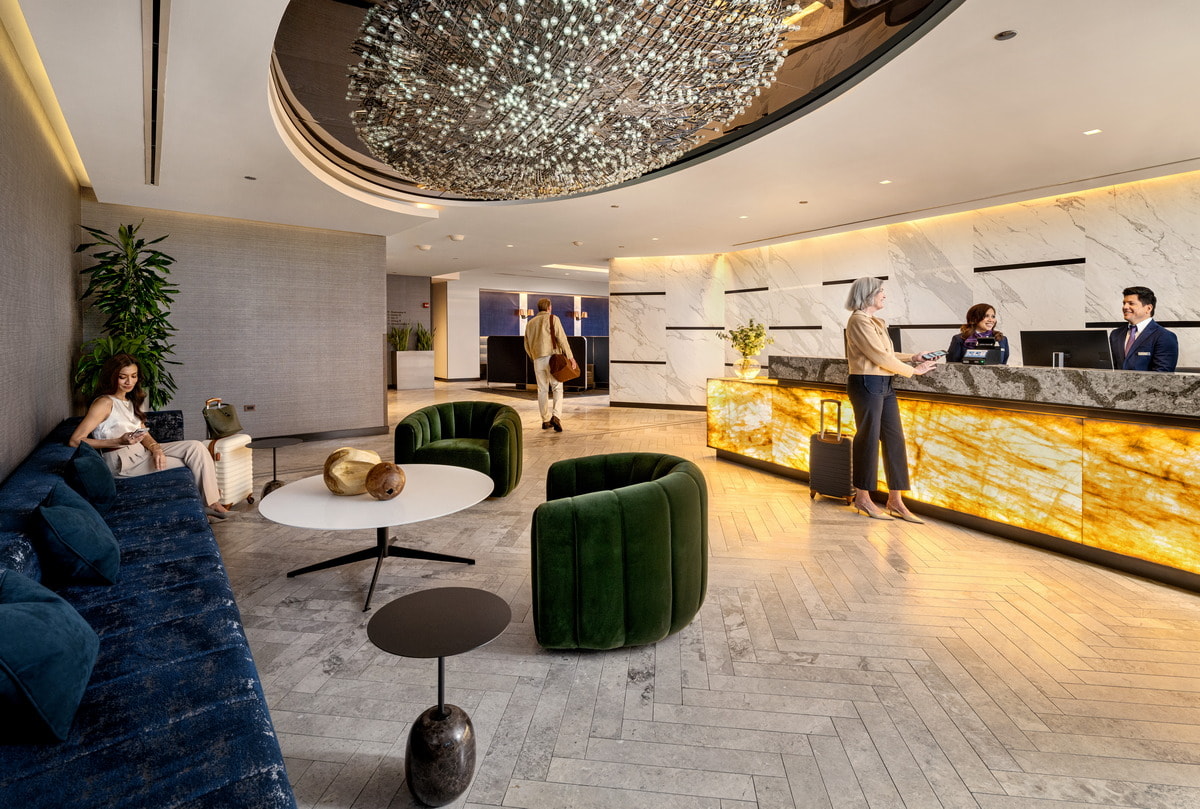 Lounge entrance area with reception desk and sofas.