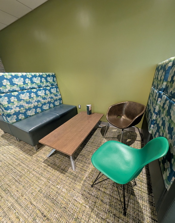 Tables and sofa area with some chairs.