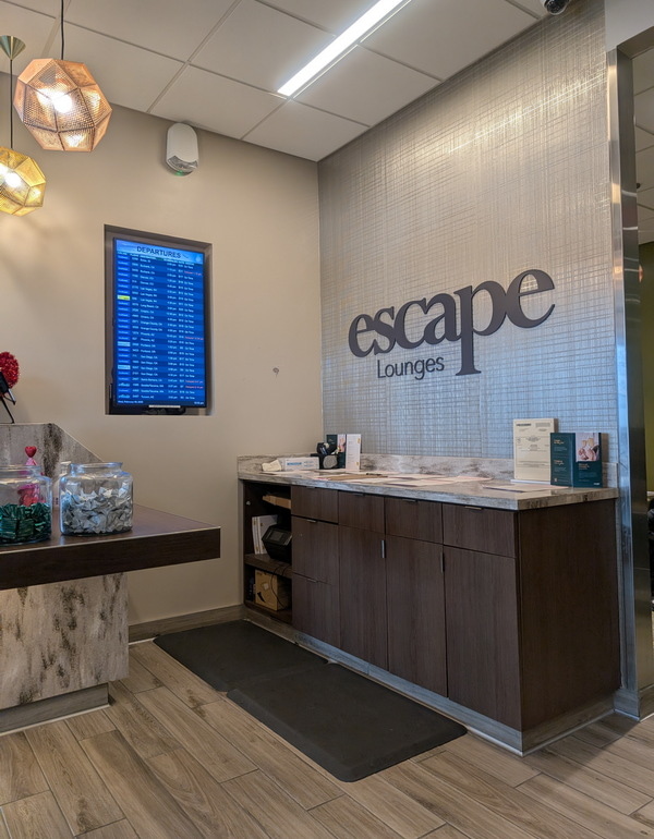 Entrance area showing a flight monitor and reception desk.