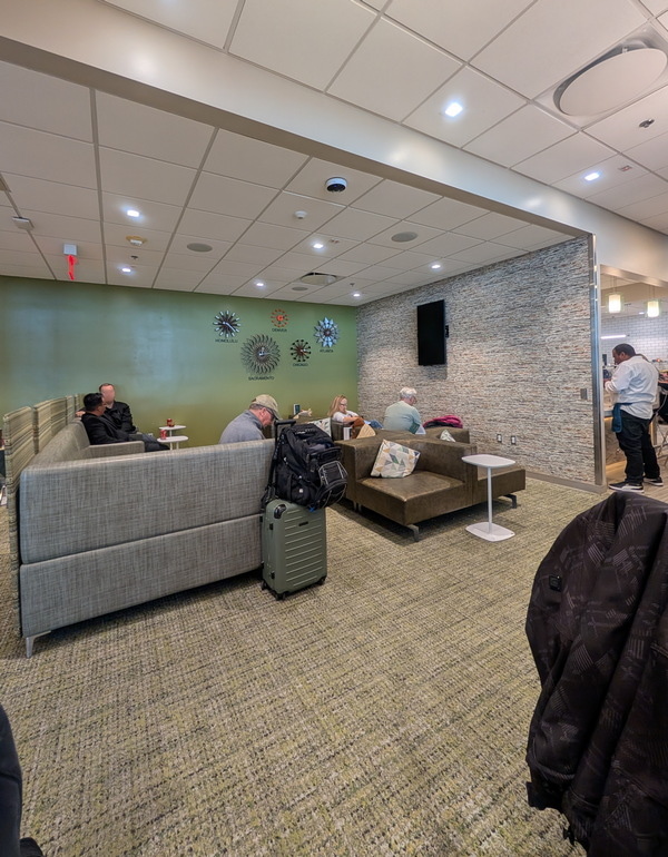 main seating area with sofa, chairs, and tables.