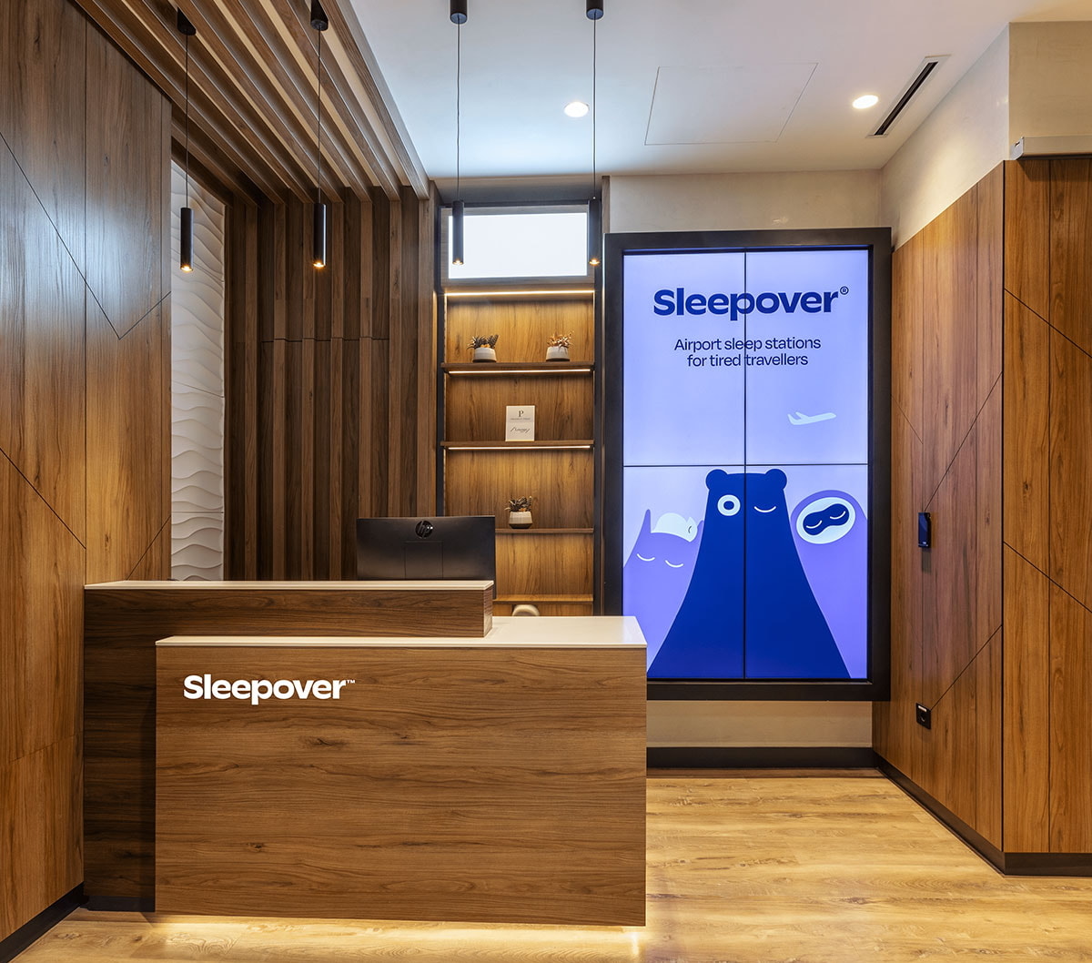 Sleepover lounge check-in counter and desk.