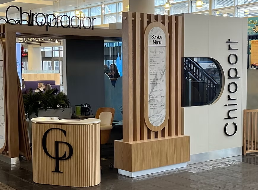 the entrance to The Chiroport with check-in desk and menu of services.