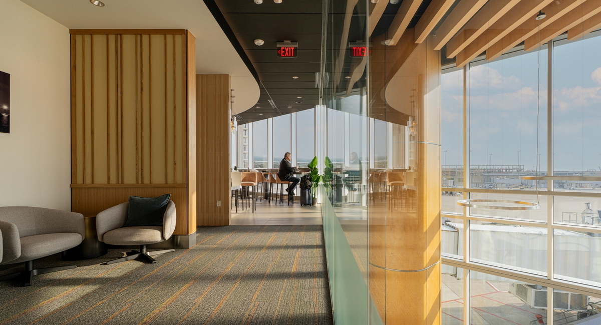 Lounge with view of the windows and seating area.