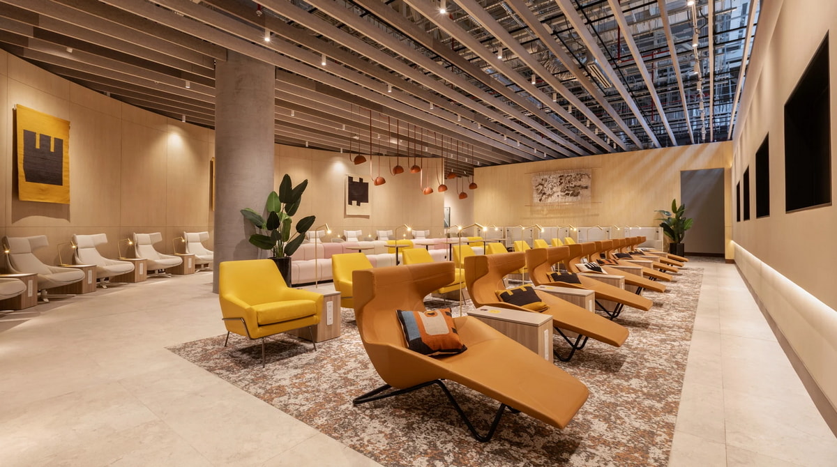 Seating area with tables and chairs.